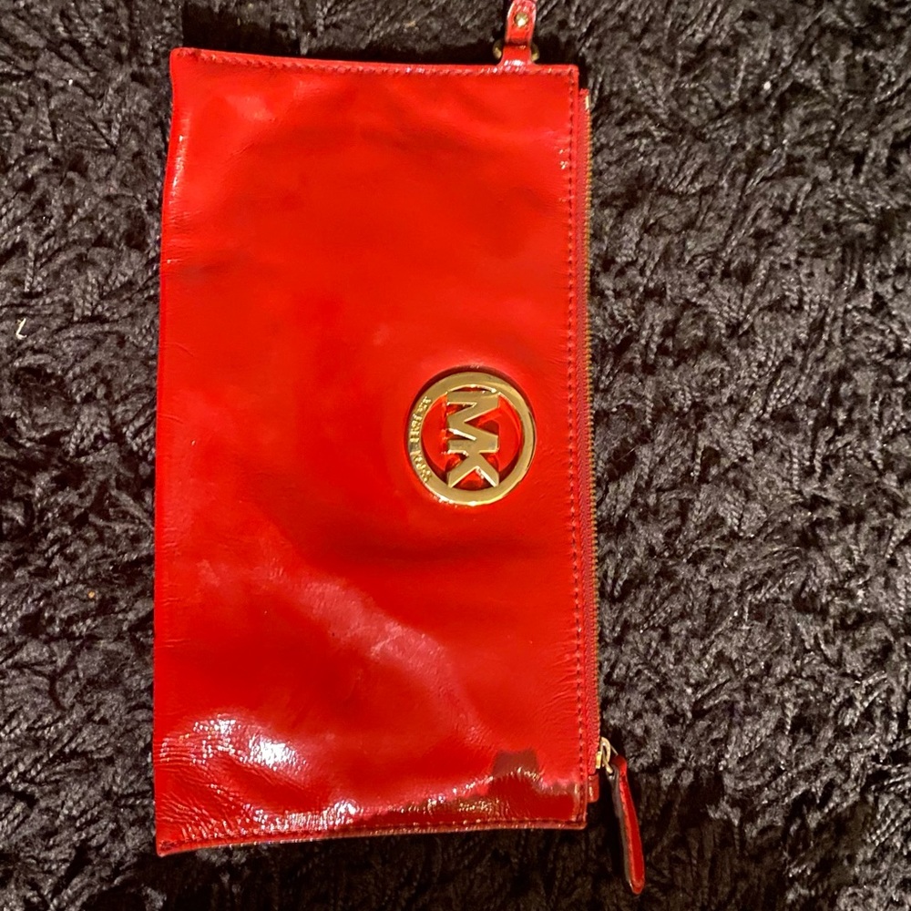 Michael Kors red wristlet bag.
